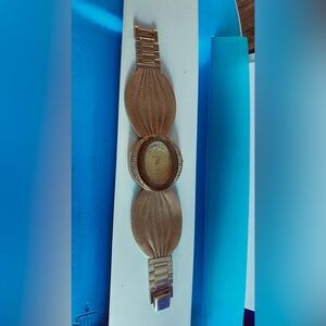 Gorgeous gold tone crystal watch stainless steel back